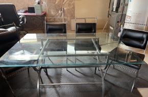 Glass dinning room table with chairs